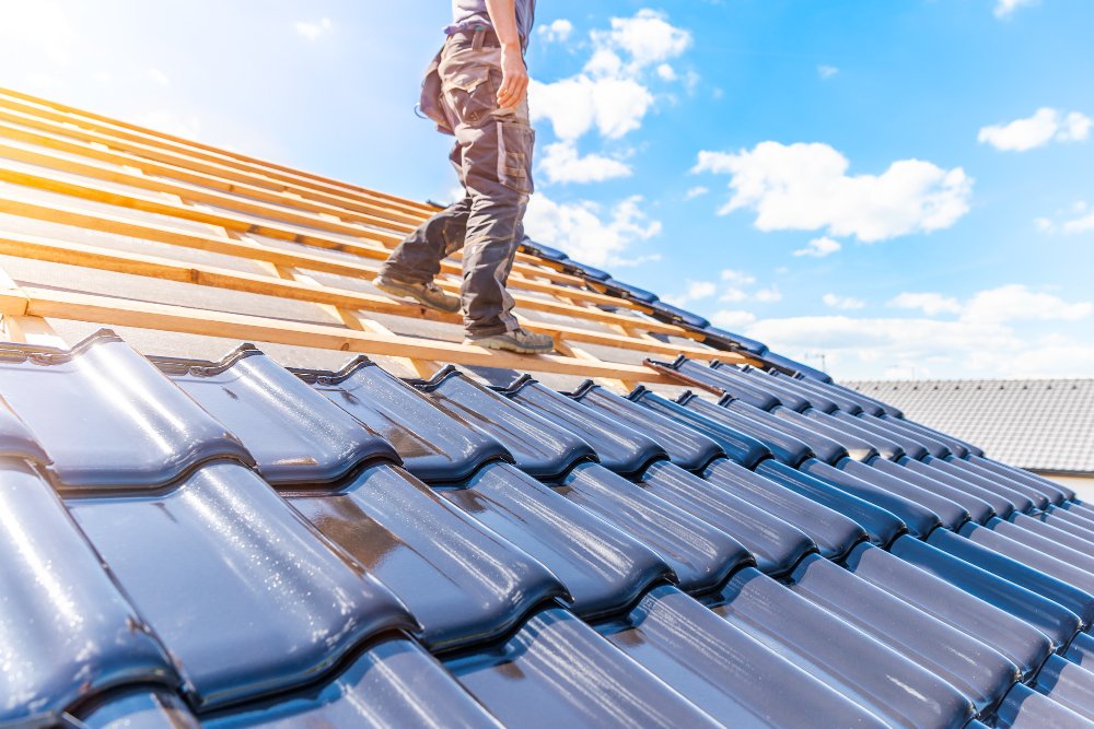 Roofer installing quality roof tiles